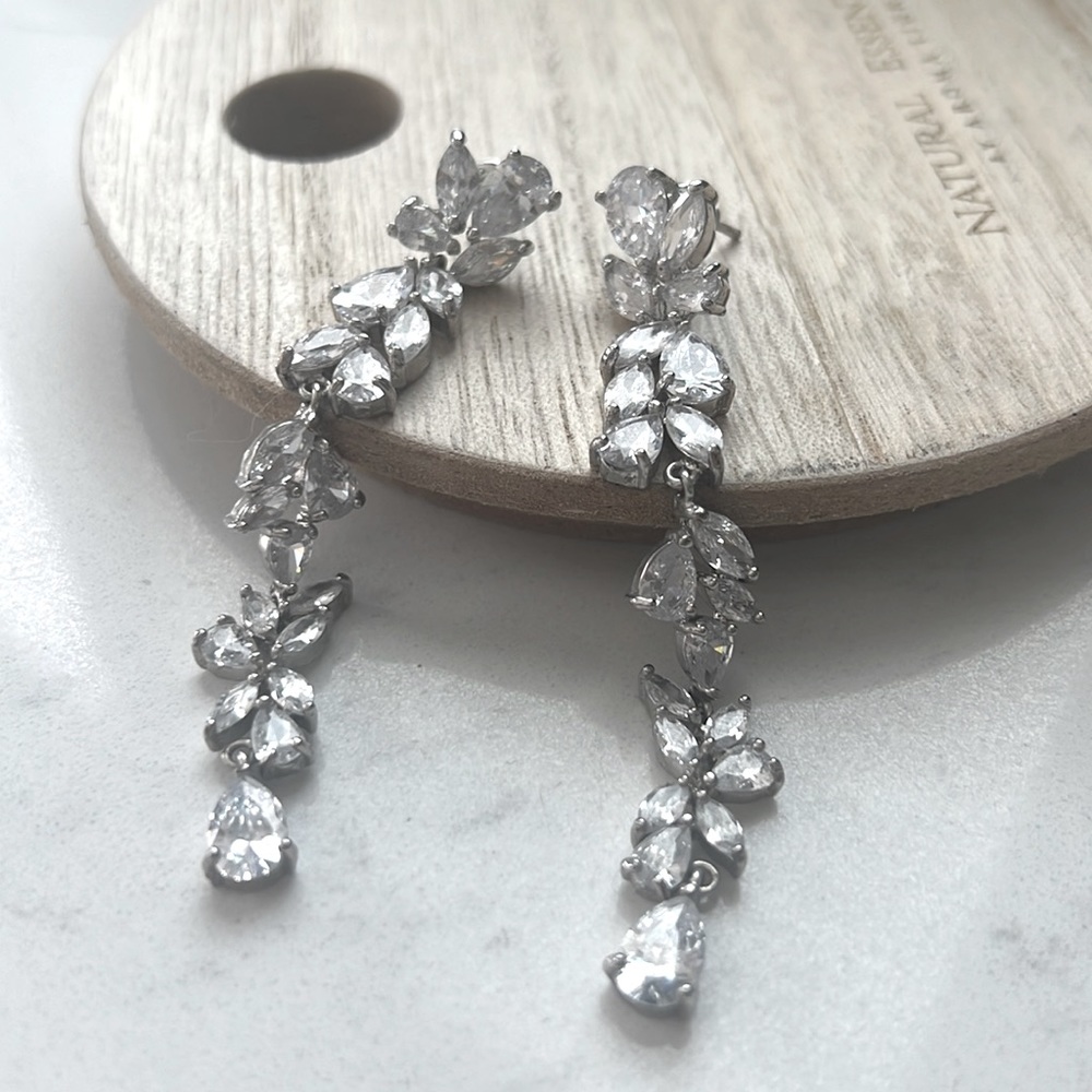Designer Wedding/ event earrings with beautiful zirconia leaf-like stones.